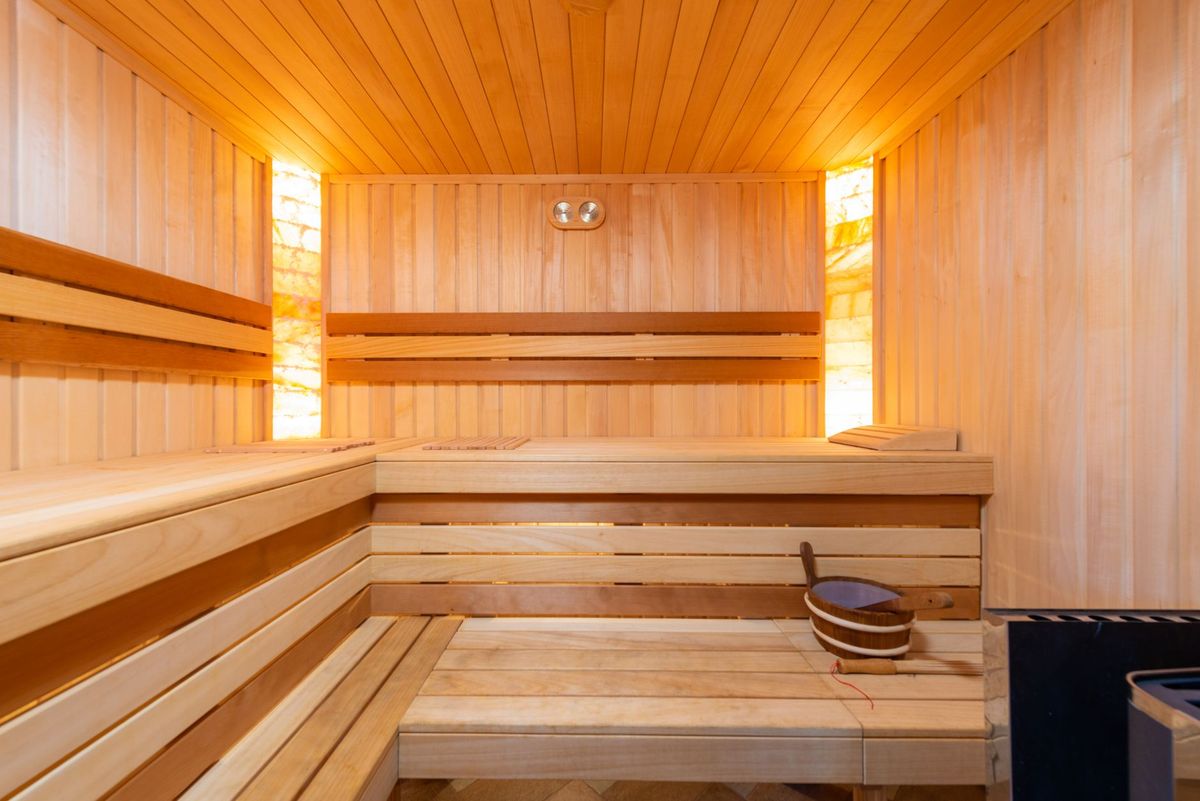 Wood-lined sauna interior in warm light